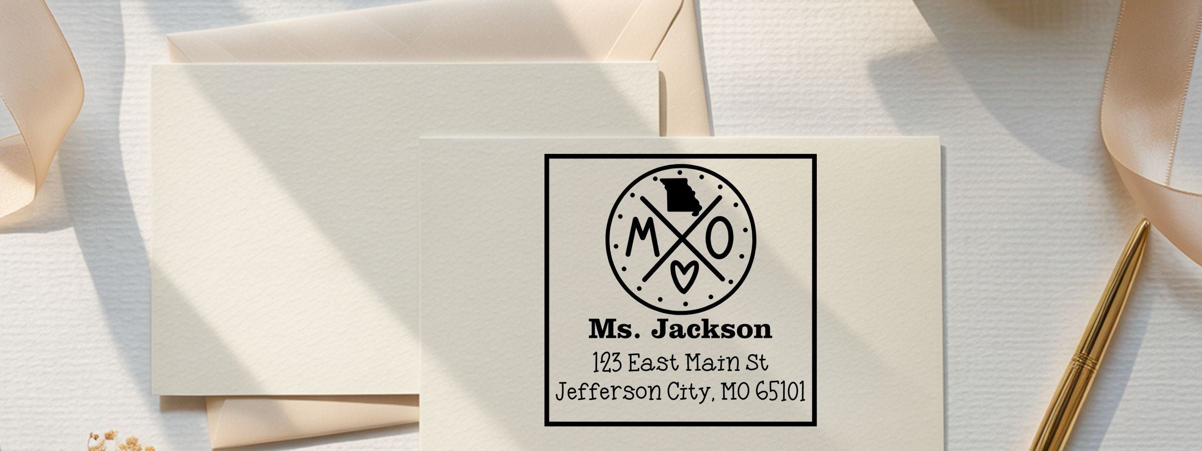 Cream stationery set, envelopes and ribbon, with Missouri monogram card for Ms. Jackson, 123 East Main St, Jefferson City, MO—Missouri Designer Stamps and Seals