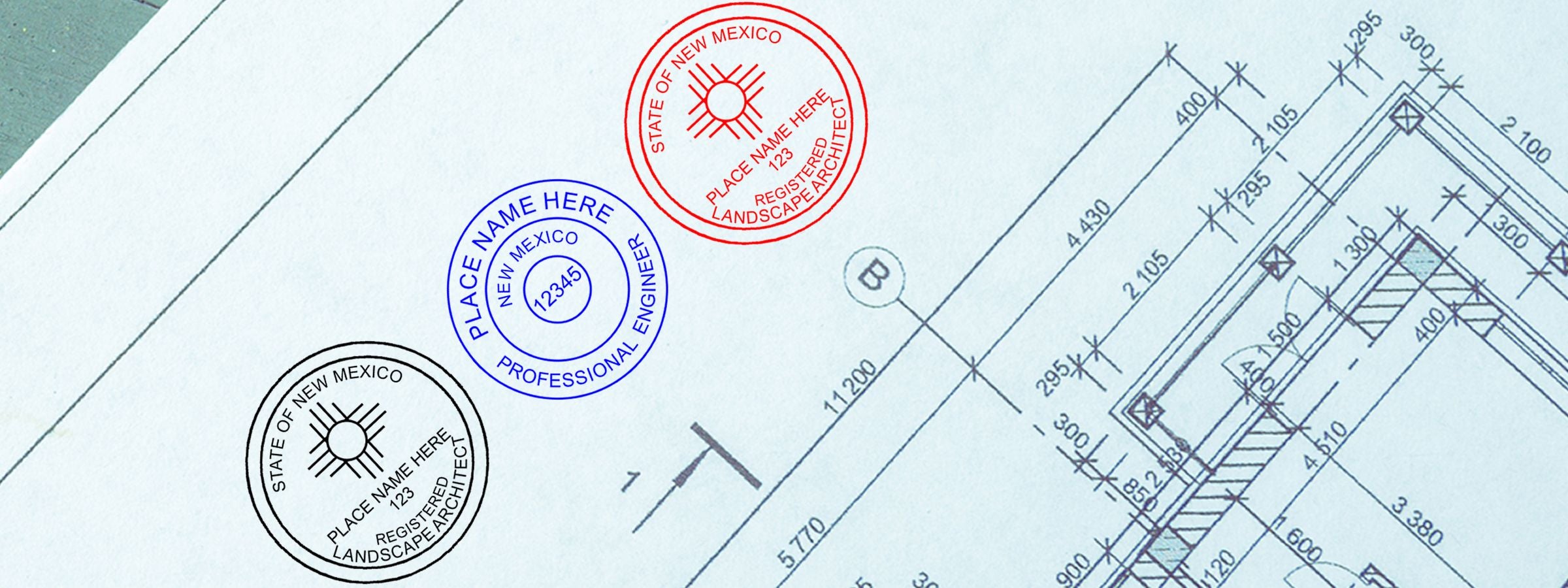 Architectural blueprint with dimension lines and three State of New Mexico seals in black, blue, and red; New Mexico Professional Seals and Stamps.