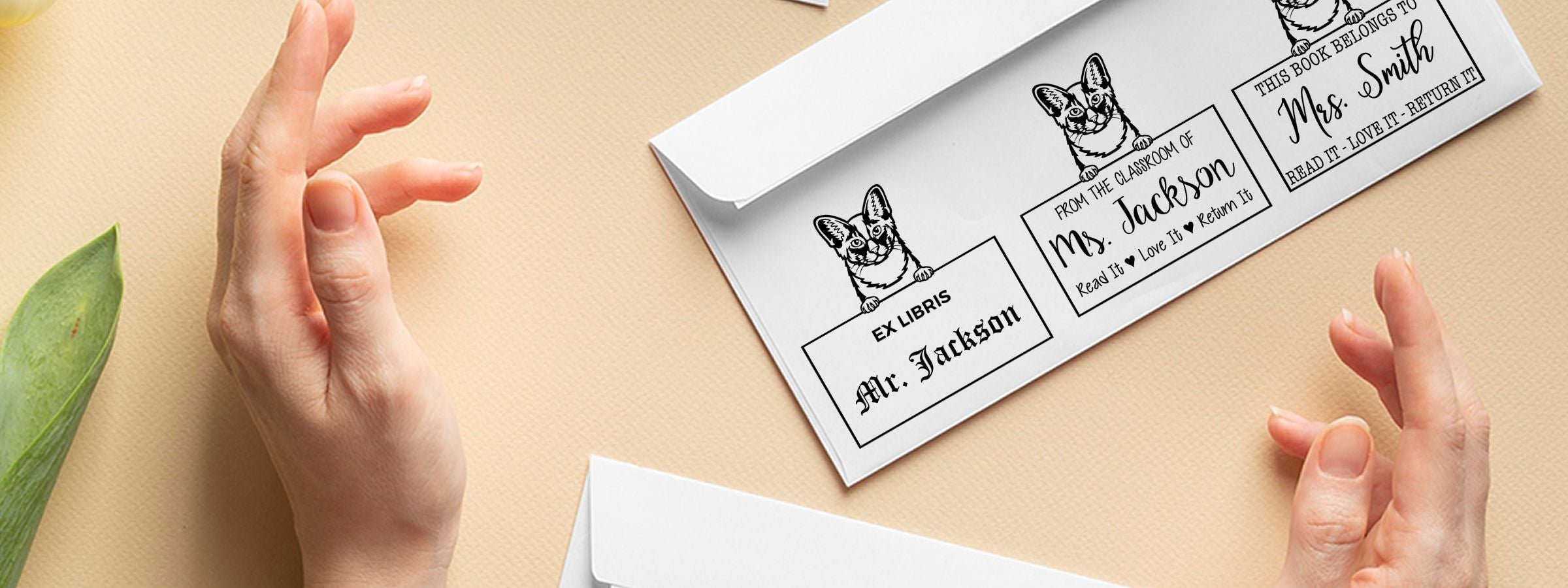 Hands frame white book return labels with cat art and Oriental Longhair Cat Stamps and Custom Seals for “Ex Libris” and classroom tags.