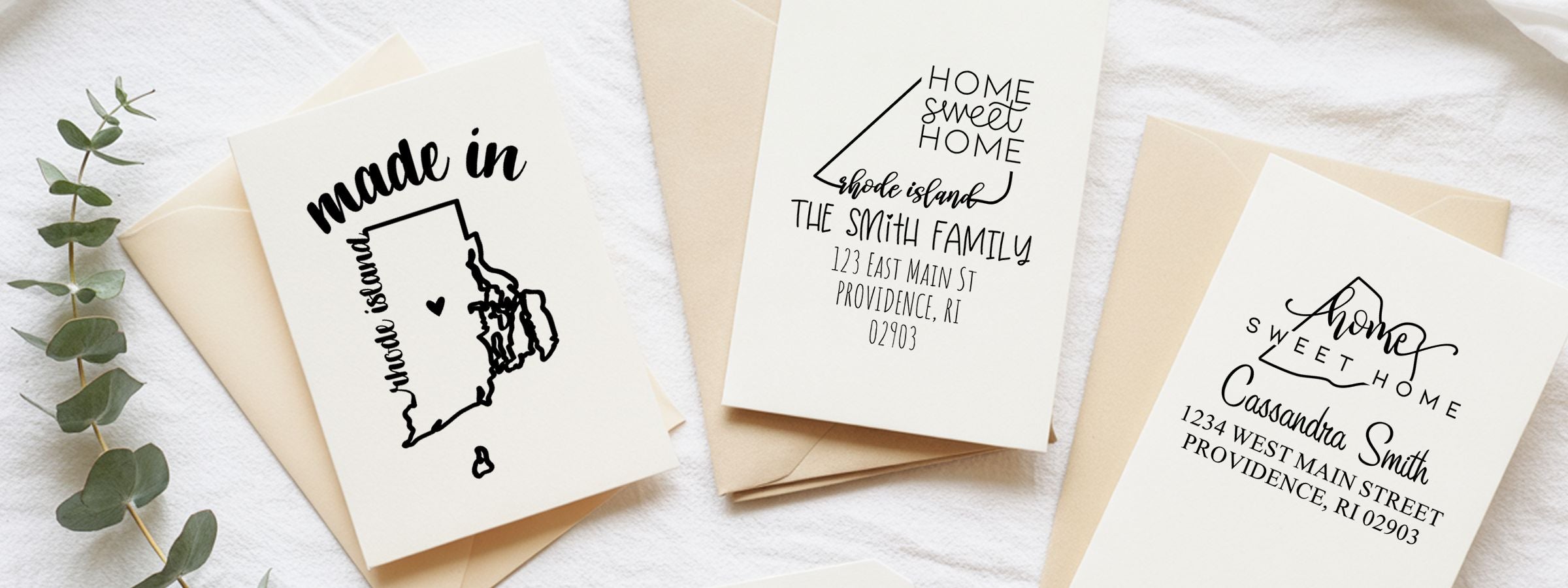 Personalized housewarming cards on beige envelopes with home sweet home designs and a Rhode Island outline, featuring Rhode Island Designer Stamps and Seals.