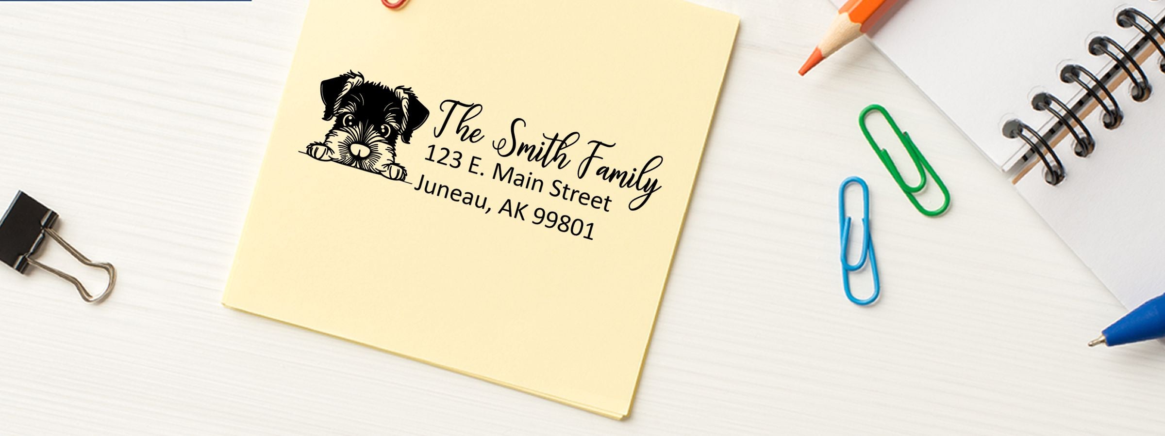 Yellow sticky note with black dog illustration, Smith Family address, and office supplies; Schnauzer Dog Stamps and Custom Seals.