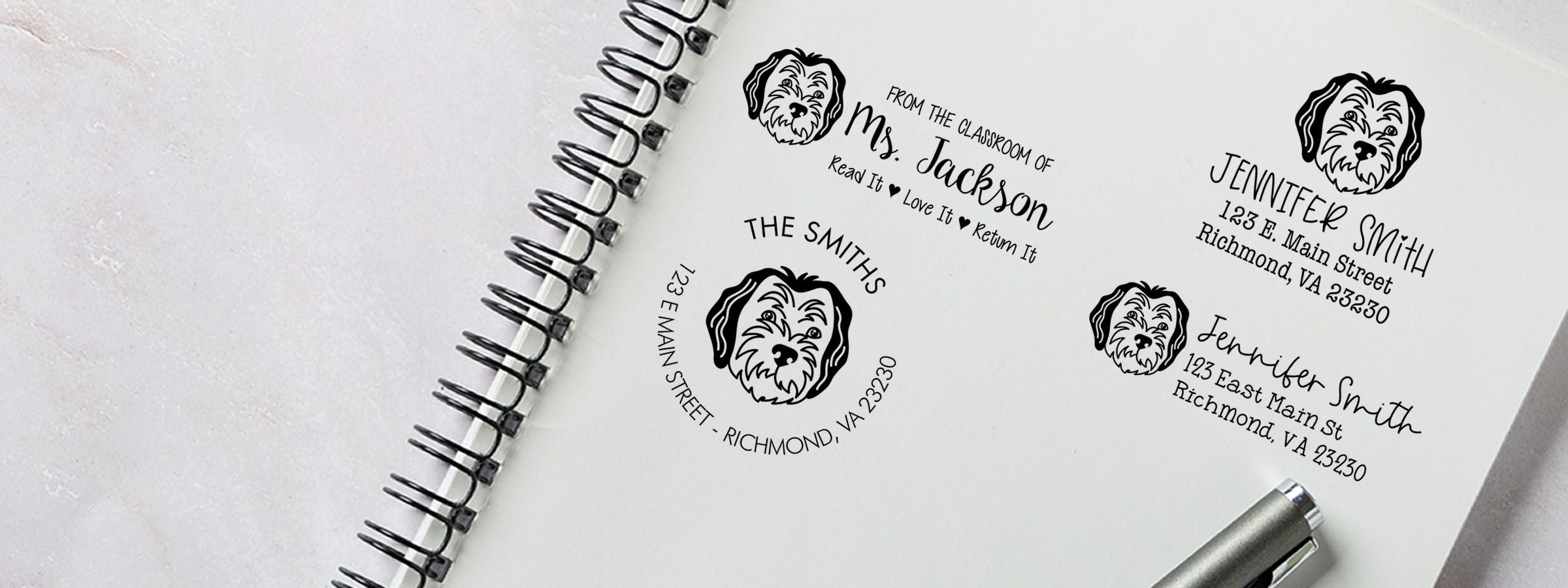 Spiral notebook showing black dog return-address labels with names, Richmond, VA addresses, and a pen; Sheepadoodle Dog Stamps and Custom Seals