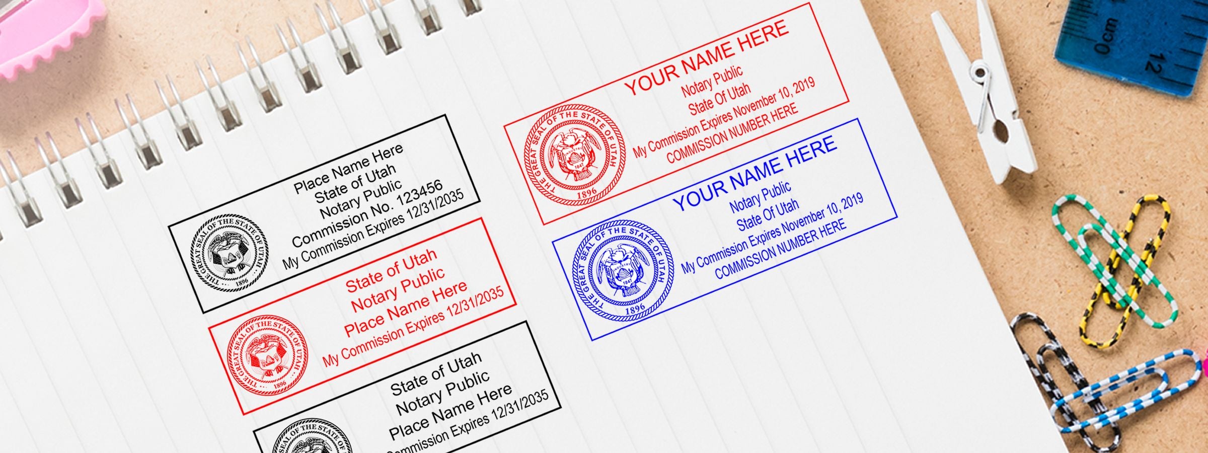 Notebook page showing four Utah notary public stamp examples in black, red and blue, with clips, ruler and paper clips; Utah Notary Supplies, Stamps and Seals