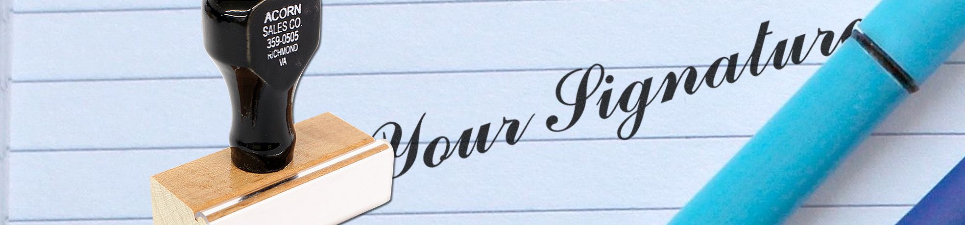 Close-up of a pen, signature stamp, and “Your Signature” on lined paper for Signature Stamps.