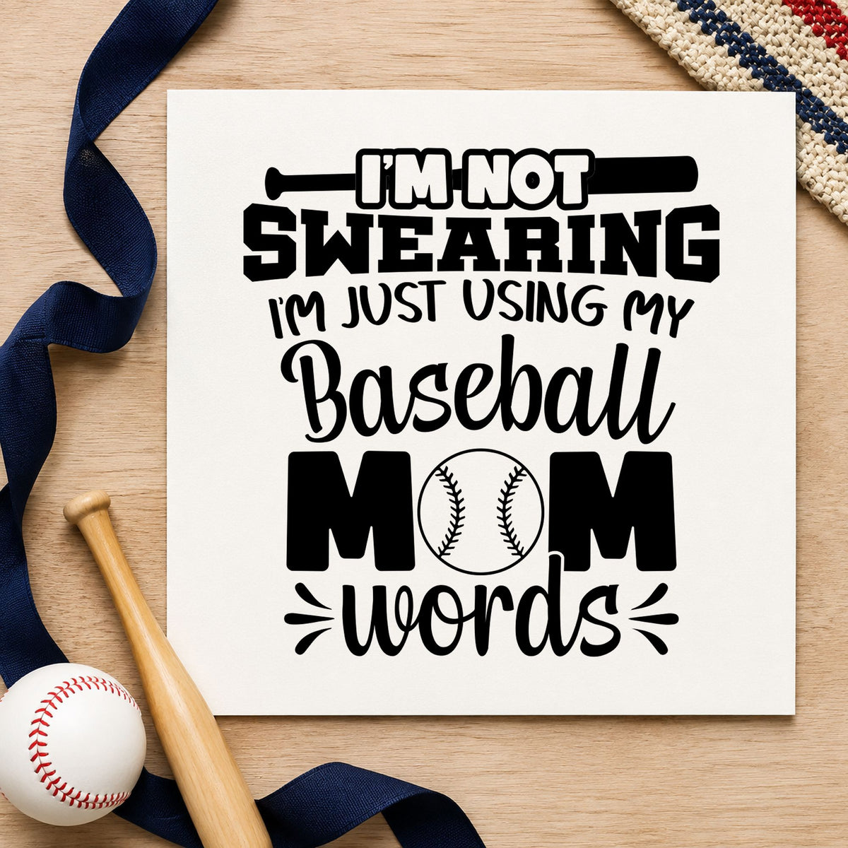 Baseball Mom Words craft stamp imprint in black ink on a handmade project, one idea being bleacher scrapbook pages.