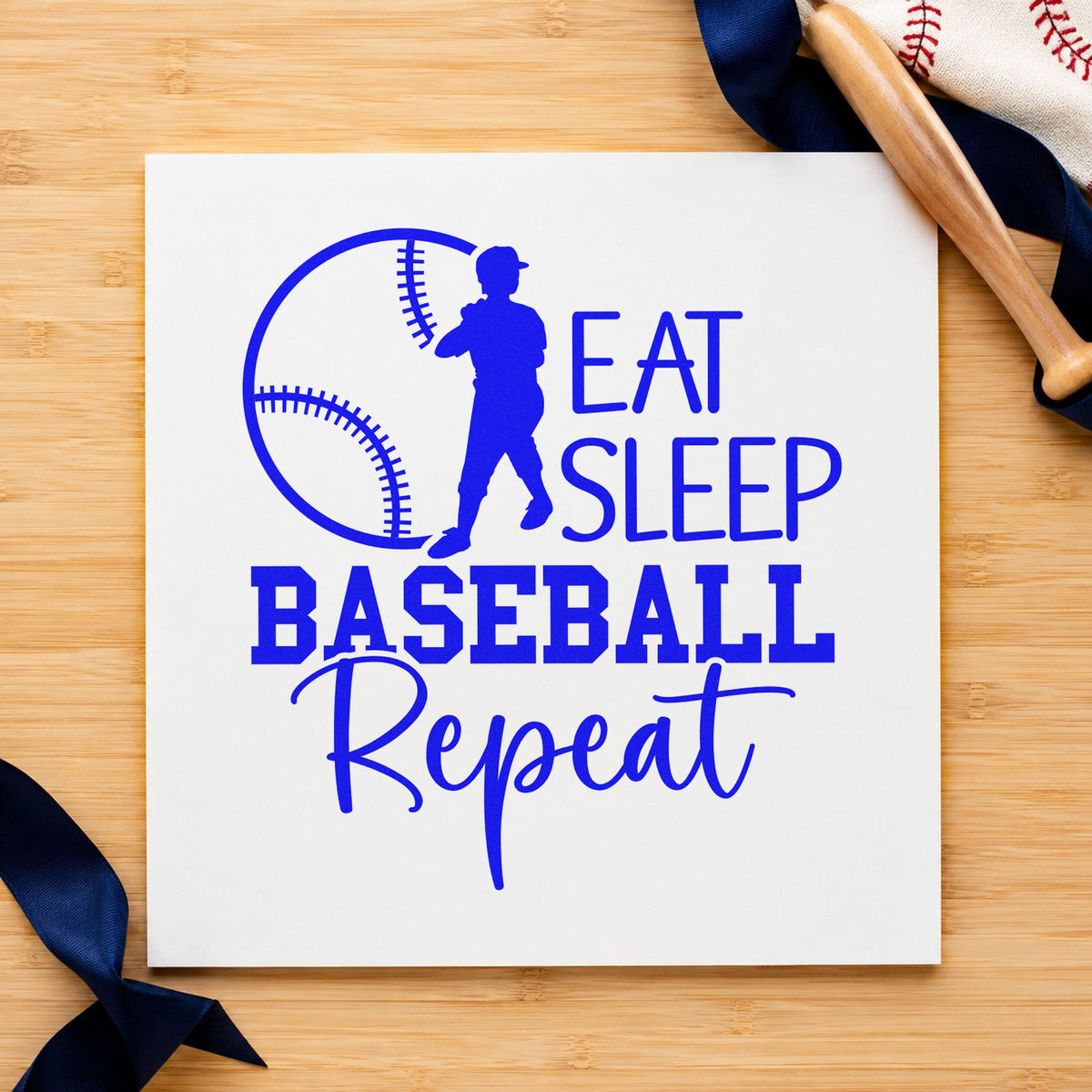 Eat Sleep Baseball Repeat craft stamp in blue ink on cardstock, an easy option for practice tees.