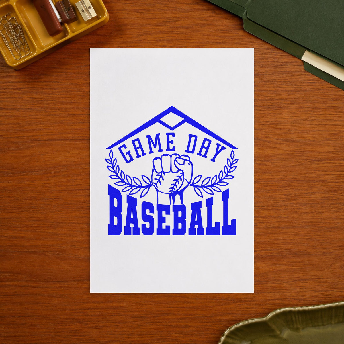 Game Day Baseball Fist craft stamp imprinted in blue ink on paper, a design suited to fan shirt transfers.
