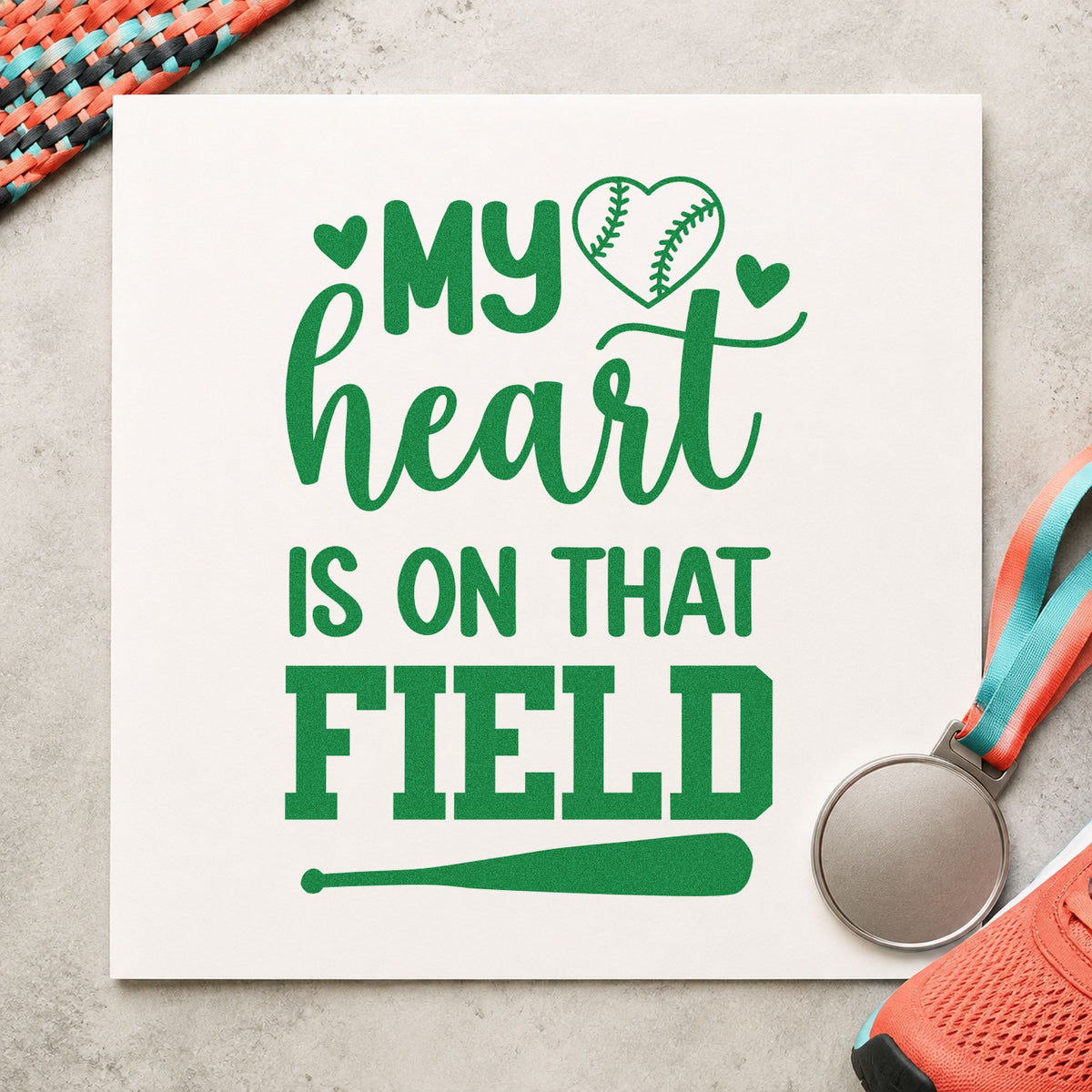 Heart on the Field Bat craft stamp imprint in green ink on a handmade project, one idea being photo book inserts.