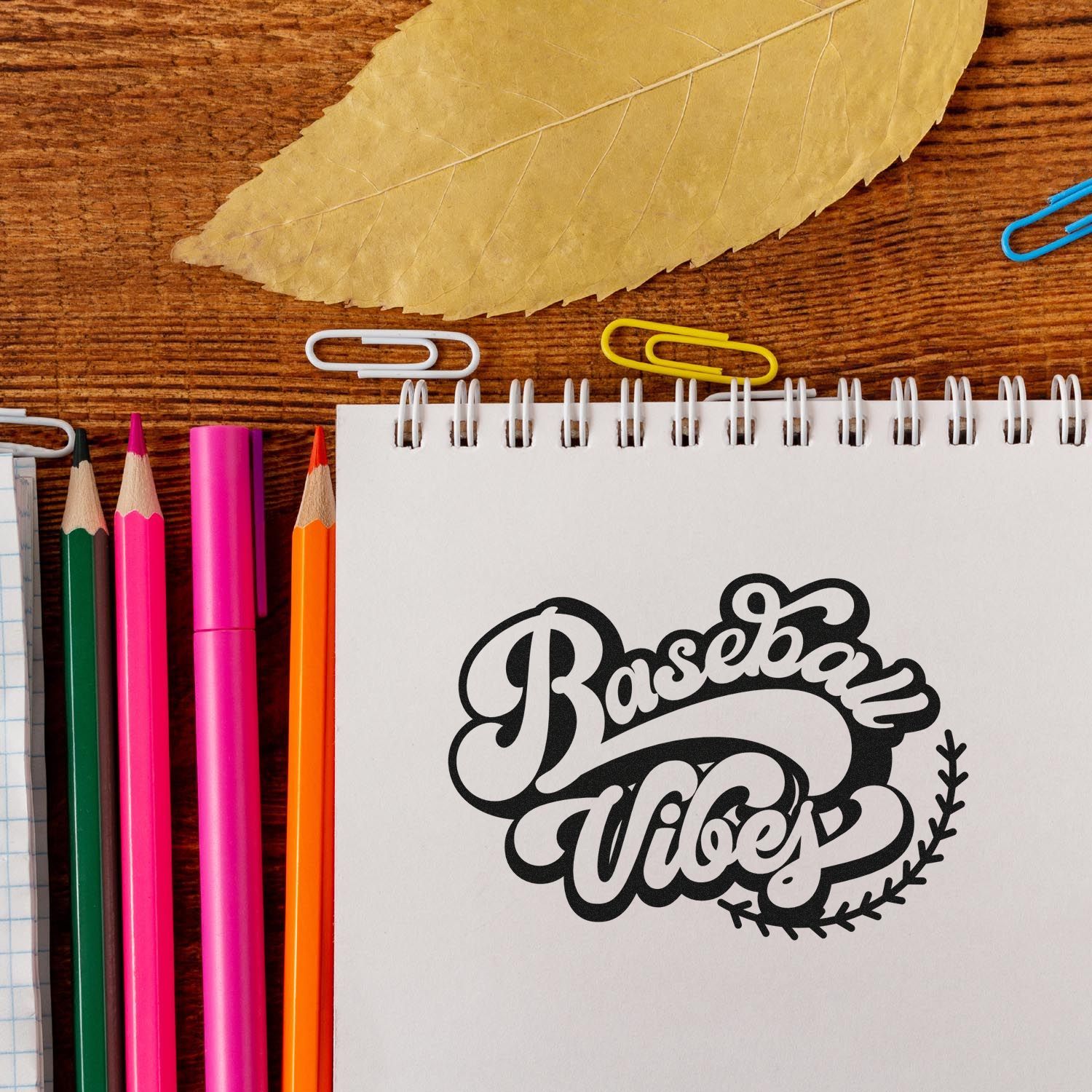 Baseball Vibes rubber stamp design on notebook, ideal for sports-themed journals, scrapbooks, and custom stationery.