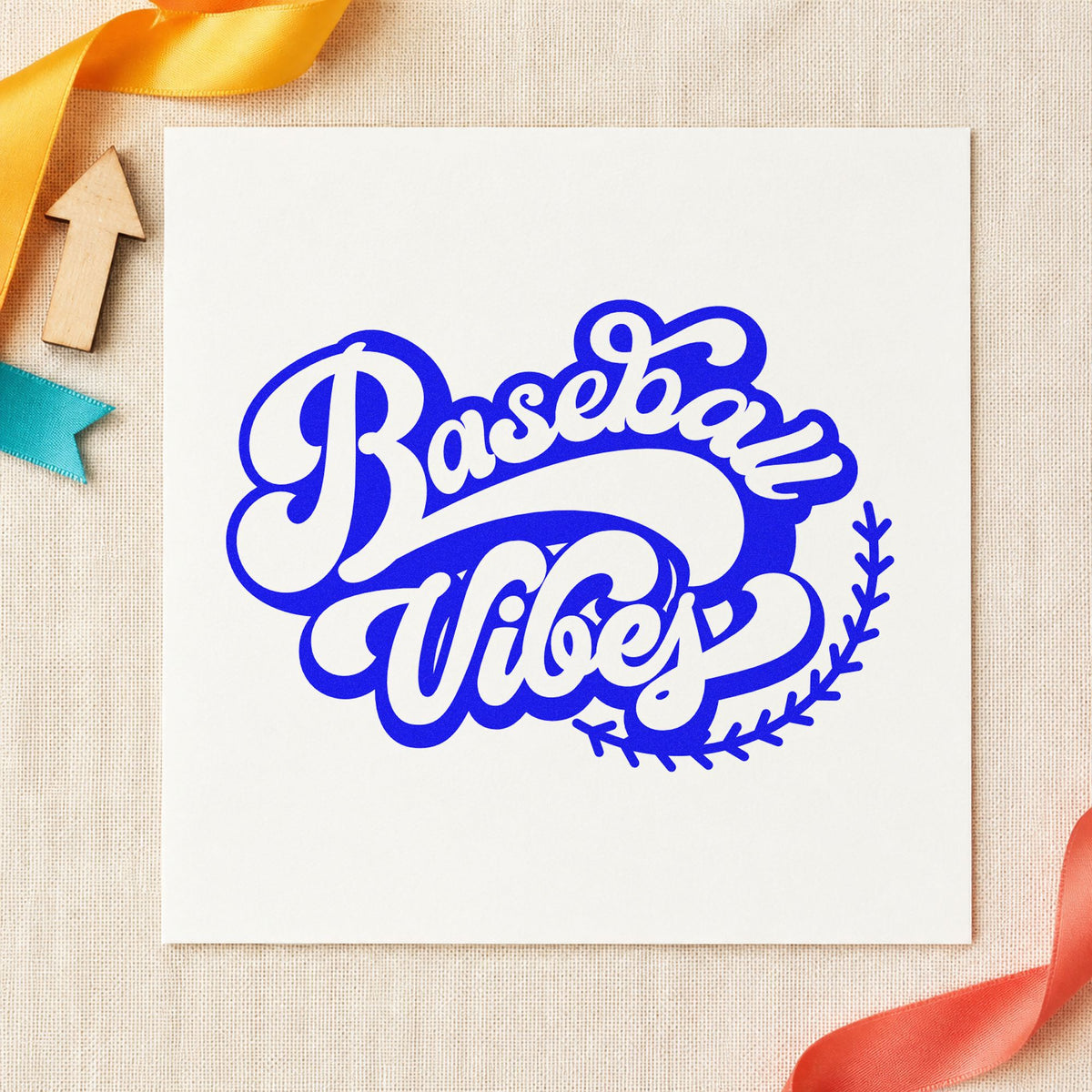 Baseball Vibes craft stamp imprinted in blue ink on paper, a design suited to kraft gift wrap.