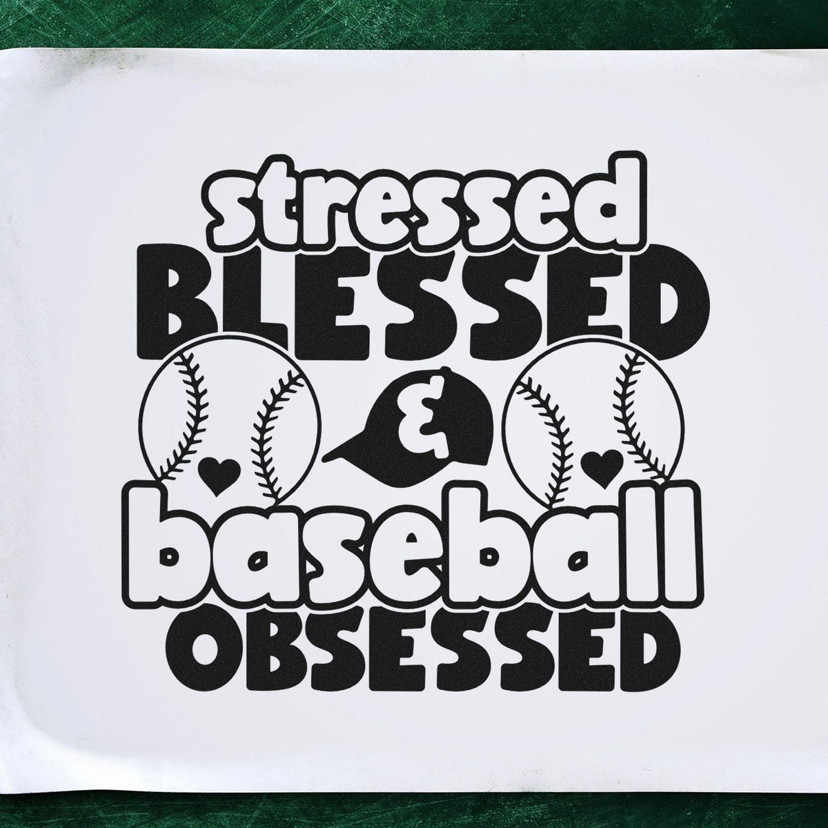 Vintage Pro Stressed Blessed & Baseball Obsessed Premium Wooden Stamp imprint stamped in black ink. Rounded and bold lettering reads "Stressed blessed & baseball obsessed," with baseballs and small hearts.