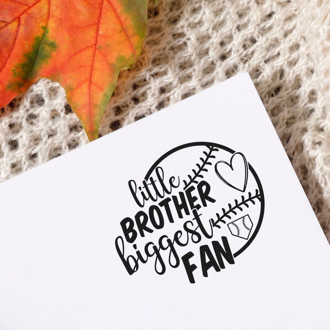 Little Brother Half Ball Fan Baseball Heart Stamp - Premium Vintage Pro Wooden imprint stamped in black ink. A half baseball, outlined heart, and small home plate accompany "Little brother biggest fan."
