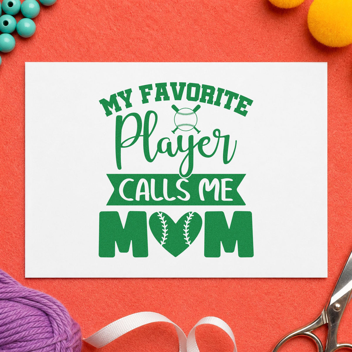 My Favorite Player Calls Me Mom craft stamp imprint in green ink on a handmade project, one idea being kitchen wall art.