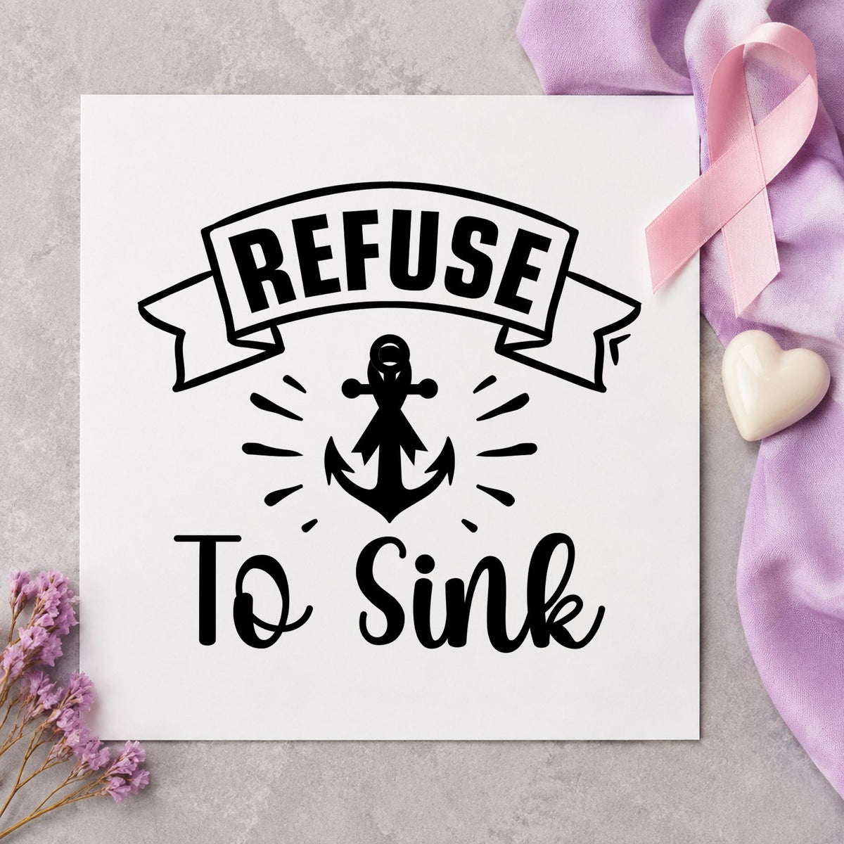 Refuse to Sink craft stamp imprint in black ink on a handmade project, one idea being nautical gift wrap.