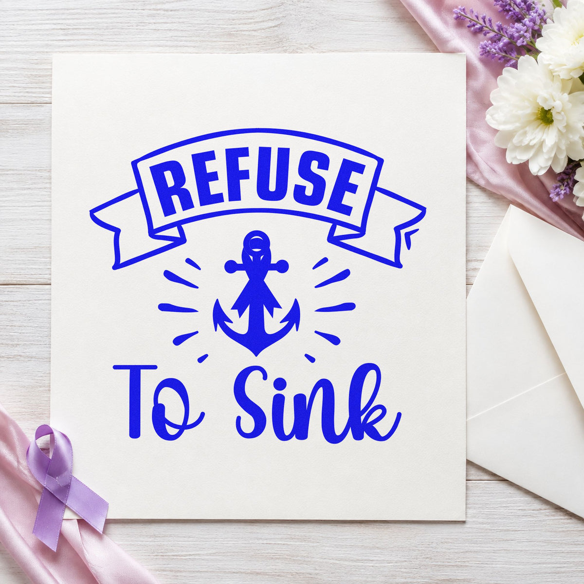 Refuse to Sink craft stamp imprinted in blue ink on paper, a design suited to everyday totes.