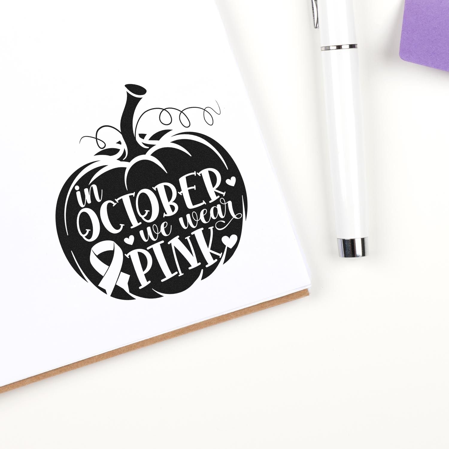 October breast cancer awareness rubber stamp featuring a pink ribbon pumpkin and In October We Wear Pink message.