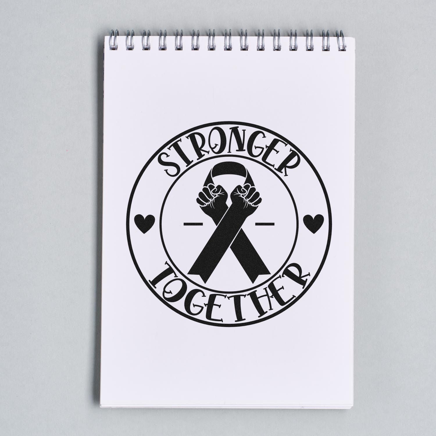 Stronger Together rubber stamp design with ribbon and raised fists, ideal for awareness and support projects.