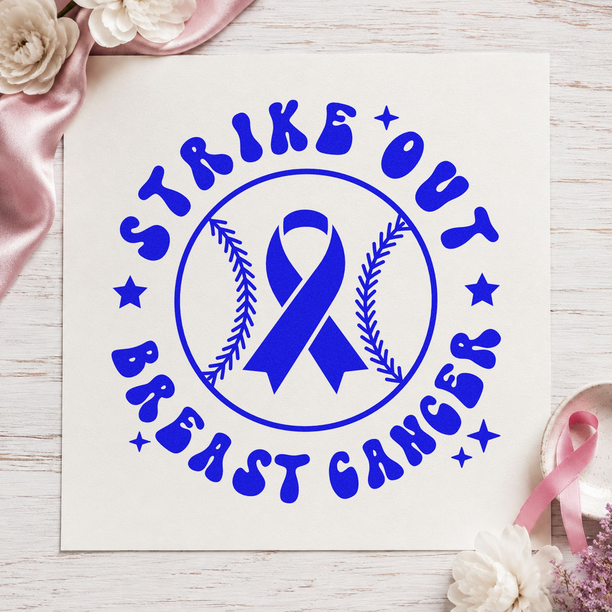 Strike Out Breast Cancer craft stamp imprinted in blue ink on paper, a design suited to scrapbook game pages.