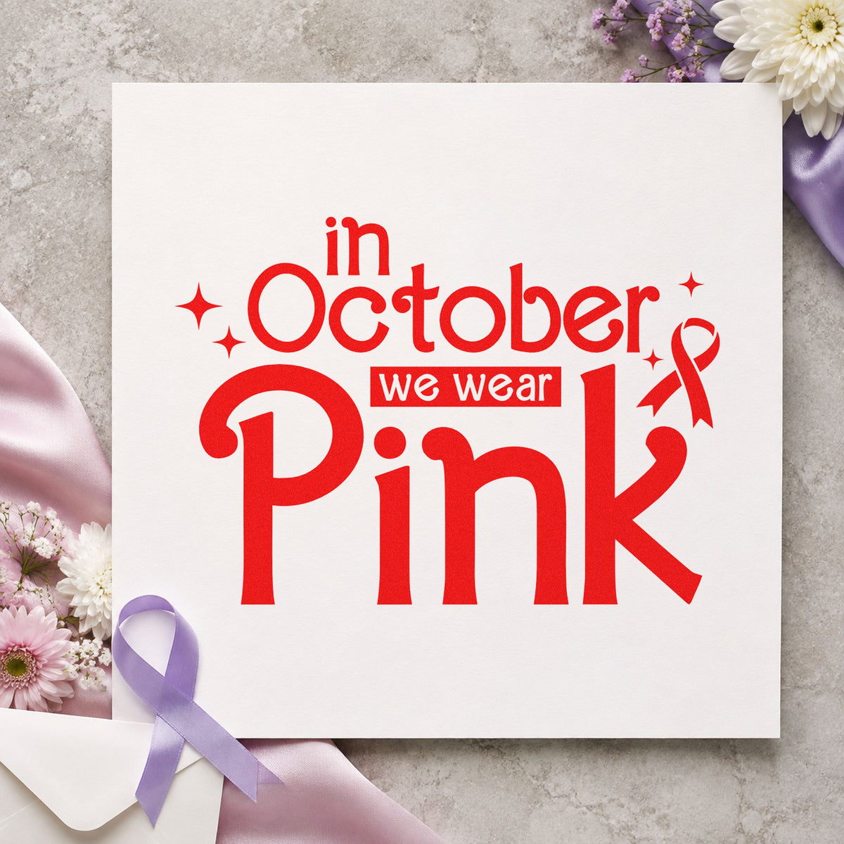 In October We Wear Pink rubber stamp shown in red ink, stamped for projects such as fan tee transfers.