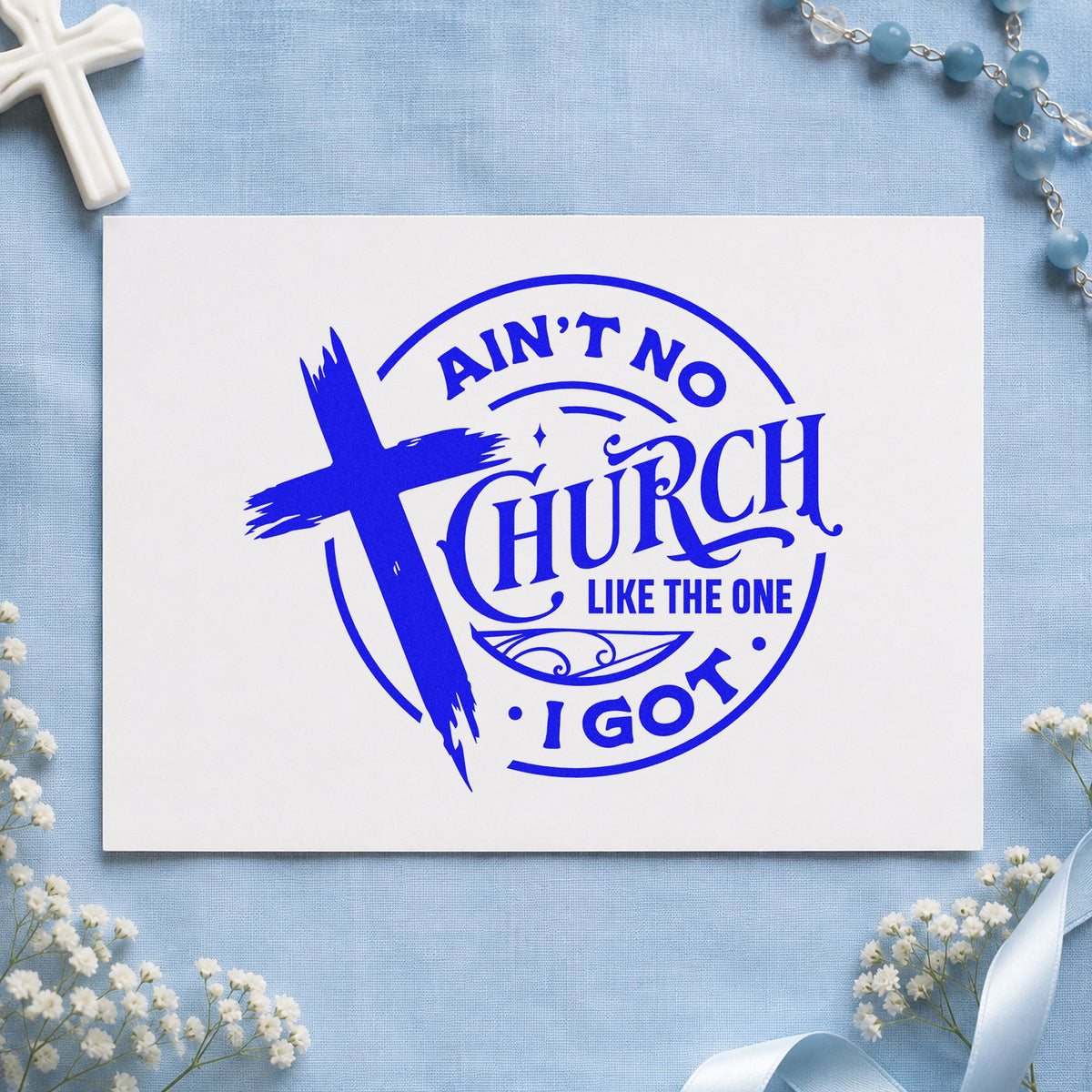 Ain't No Church Like Mine craft stamp imprinted in blue ink on paper, a design suited to fellowship hall decor.