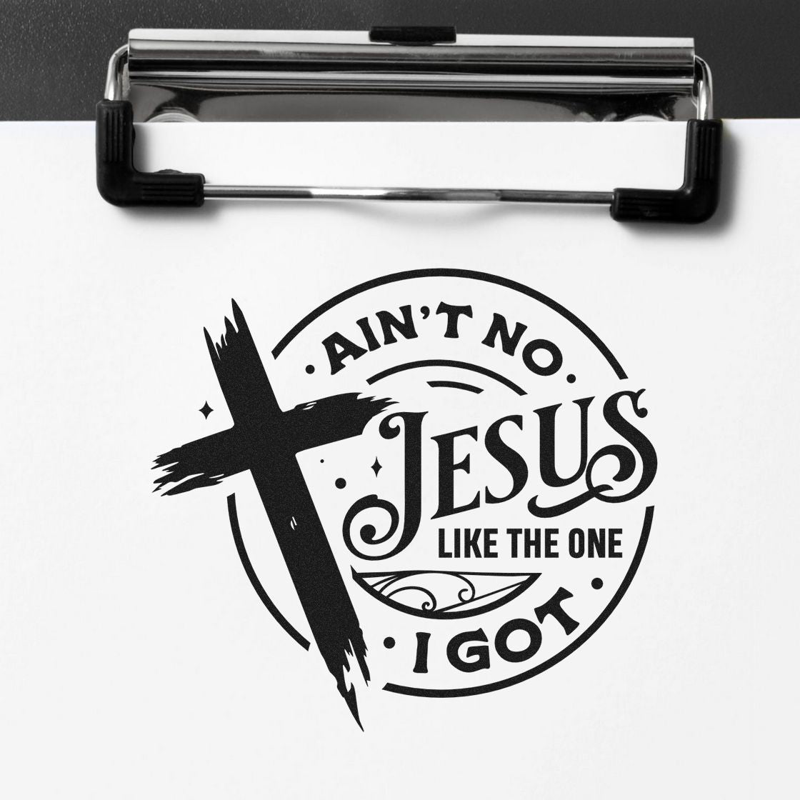 Ain't No Jesus Like Mine Premium Wooden Stamp - Vintage Pro imprint stamped in black ink. A brushstroke cross overlaps a circular design reading "Ain't no Jesus like the one I got."