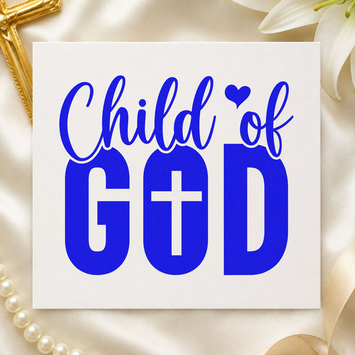 Child of God craft stamp imprinted in blue ink on paper, a design suited to newborn scrapbooks.