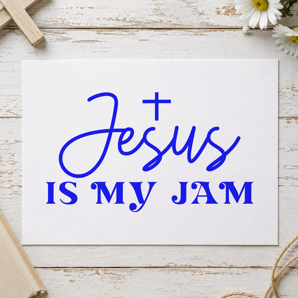 Jesus Is My Jam craft stamp imprinted in blue ink on paper, a design suited to music camp name tags.
