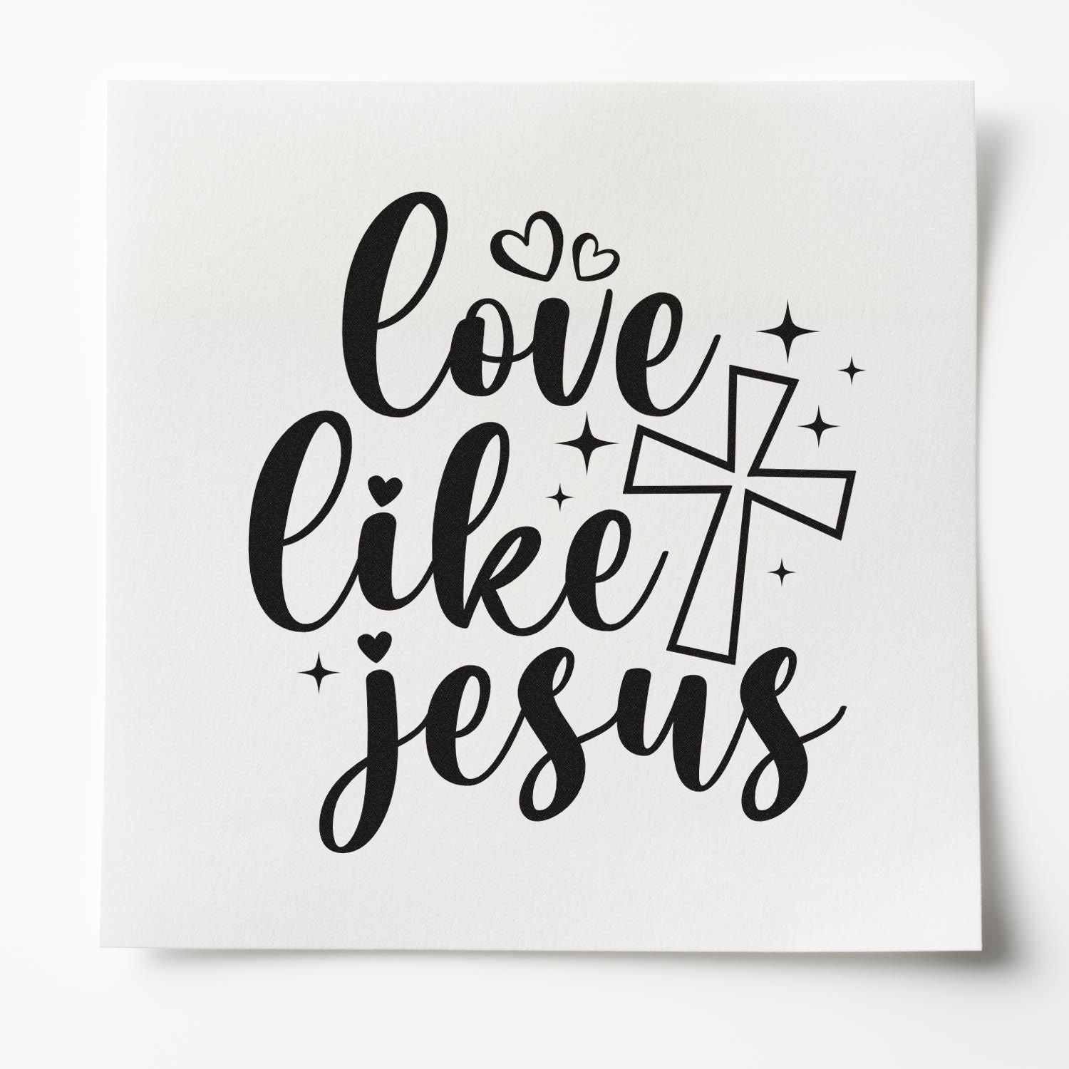 Love Like Jesus Christian rubber stamp design with cross, hearts, and sparkles on white paper