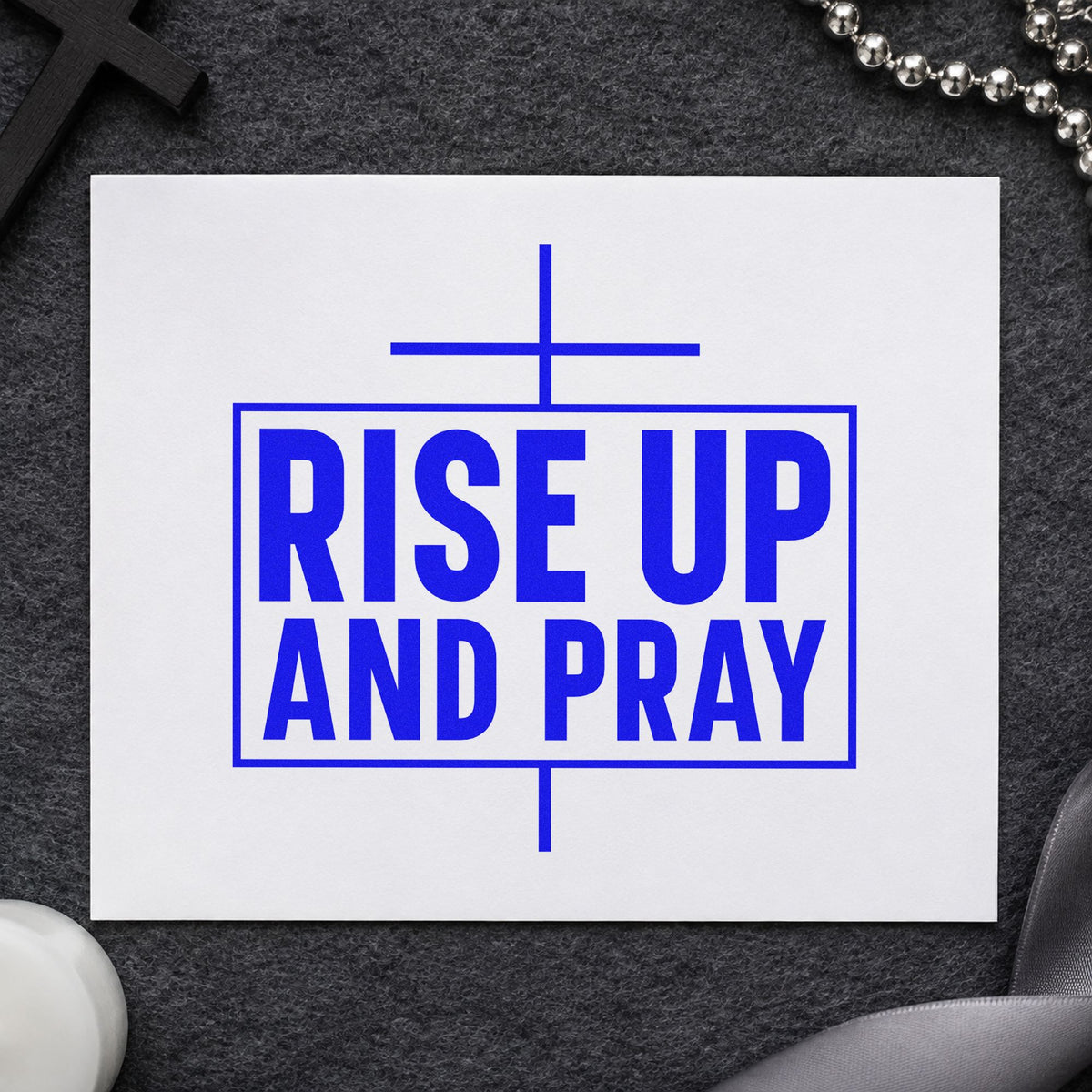 Rise Up and Pray craft stamp imprinted in blue ink on paper, a design suited to poster board signs.