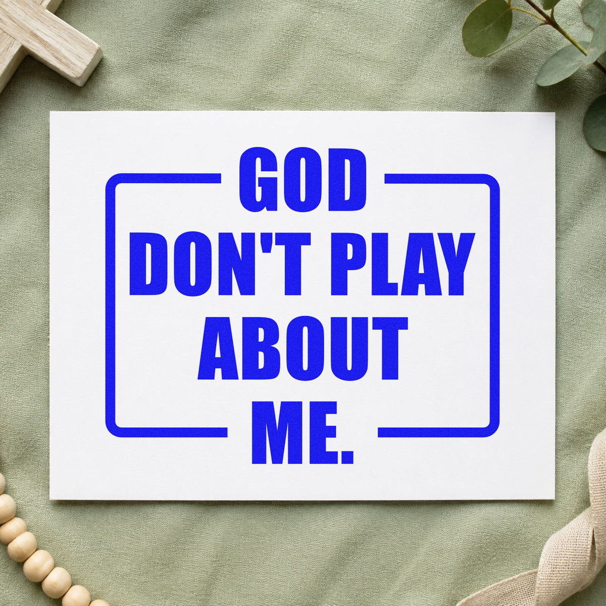 God Don't Play About Me craft stamp in blue ink on cardstock, an easy option for canvas totes.