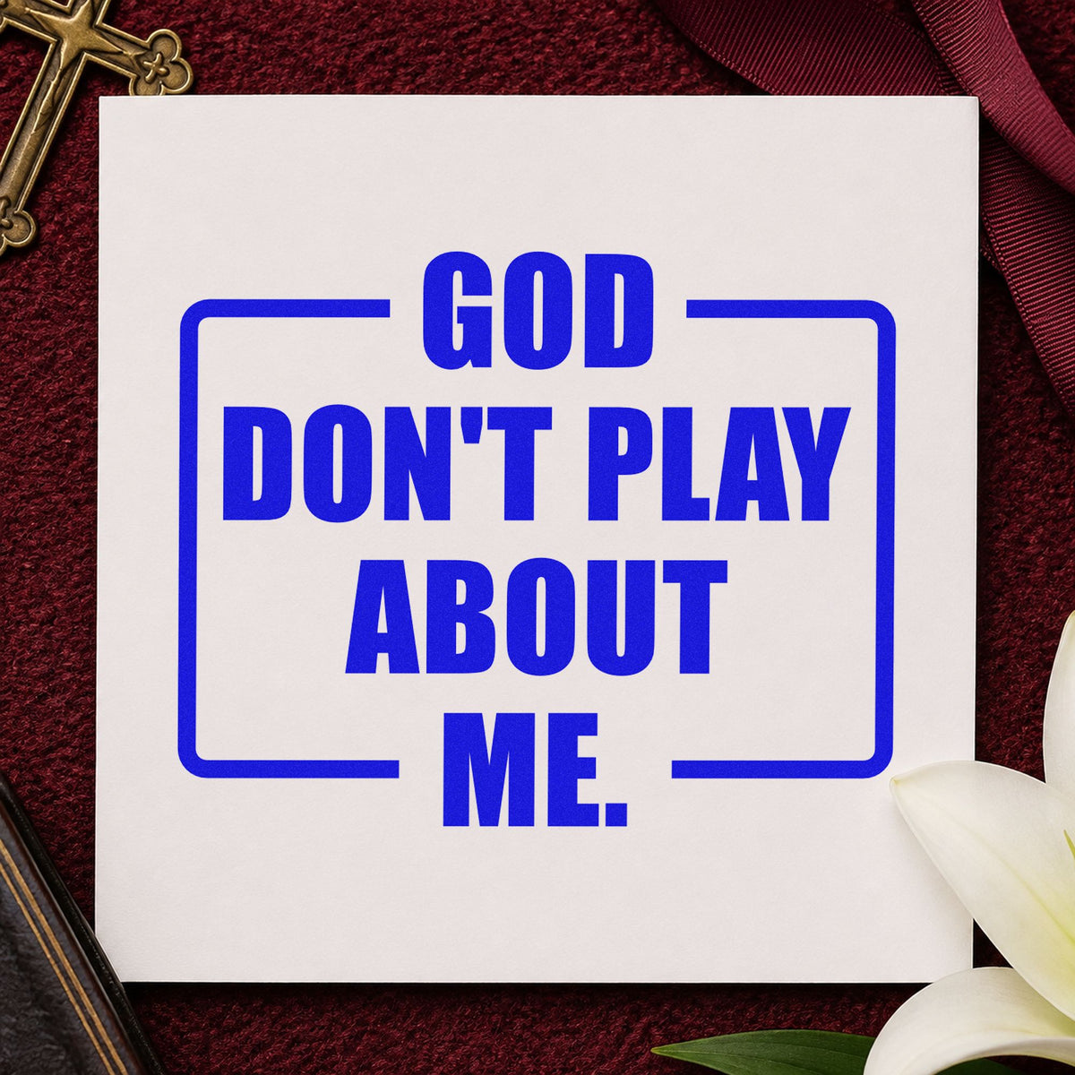 God Don't Play About Me craft stamp imprinted in blue ink on paper, a design suited to group chat gifts.