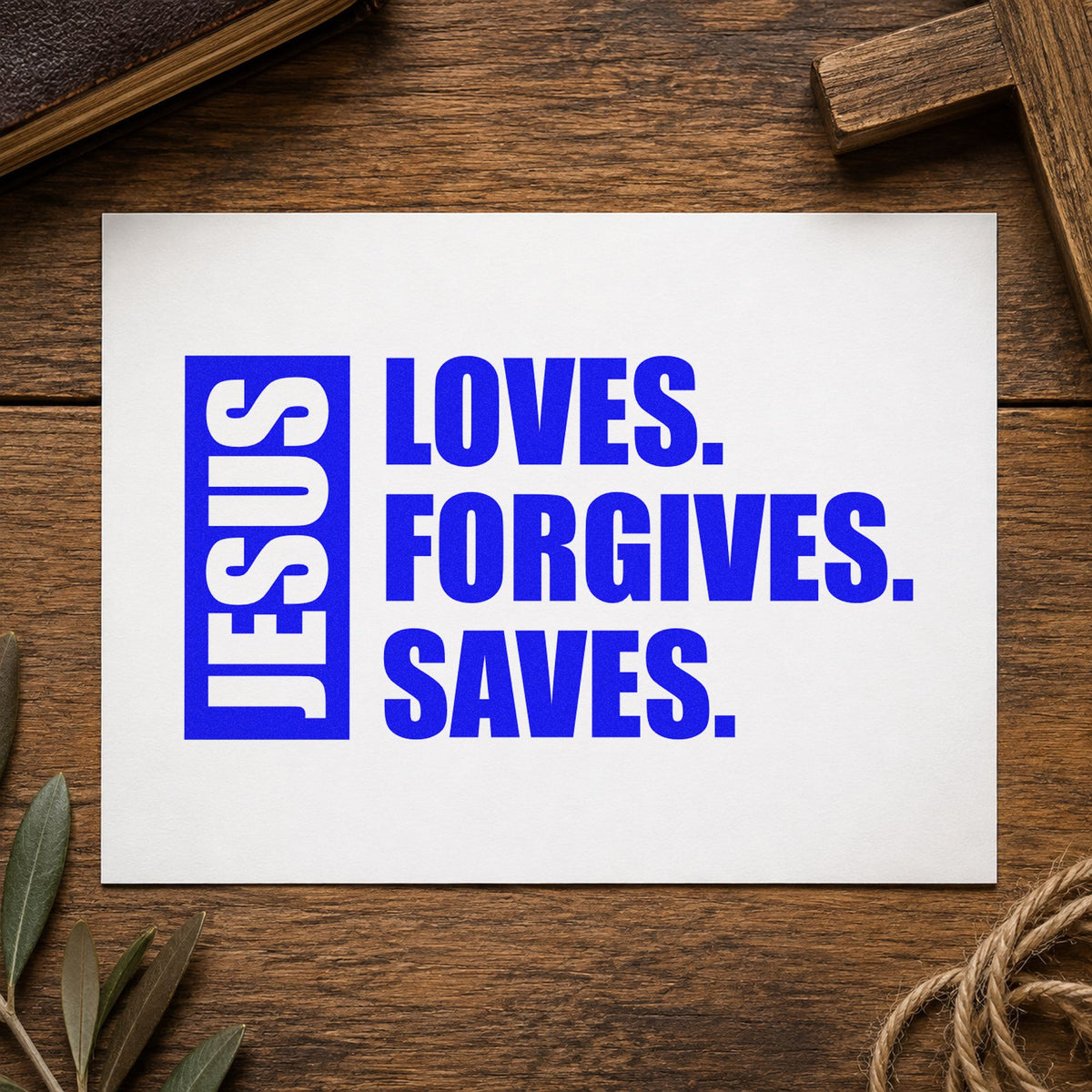Jesus Loves Forgives Saves craft stamp in blue ink on cardstock, an easy option for canvas totes.