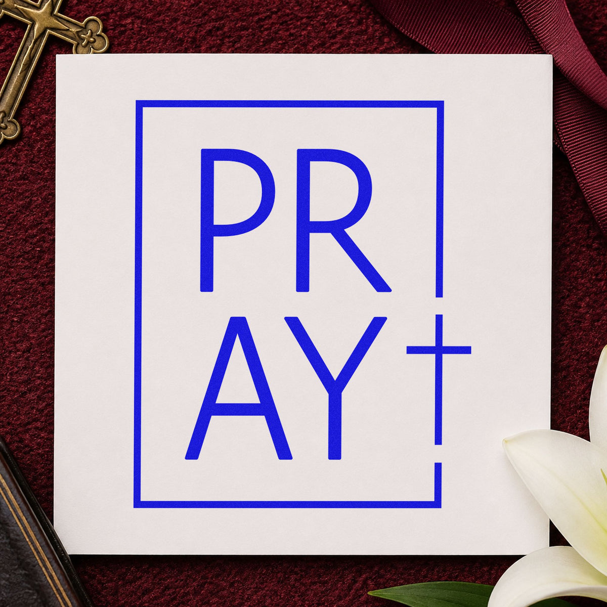 Pray Minimal Cross craft stamp imprinted in blue ink on paper, a design suited to prayer request cards.