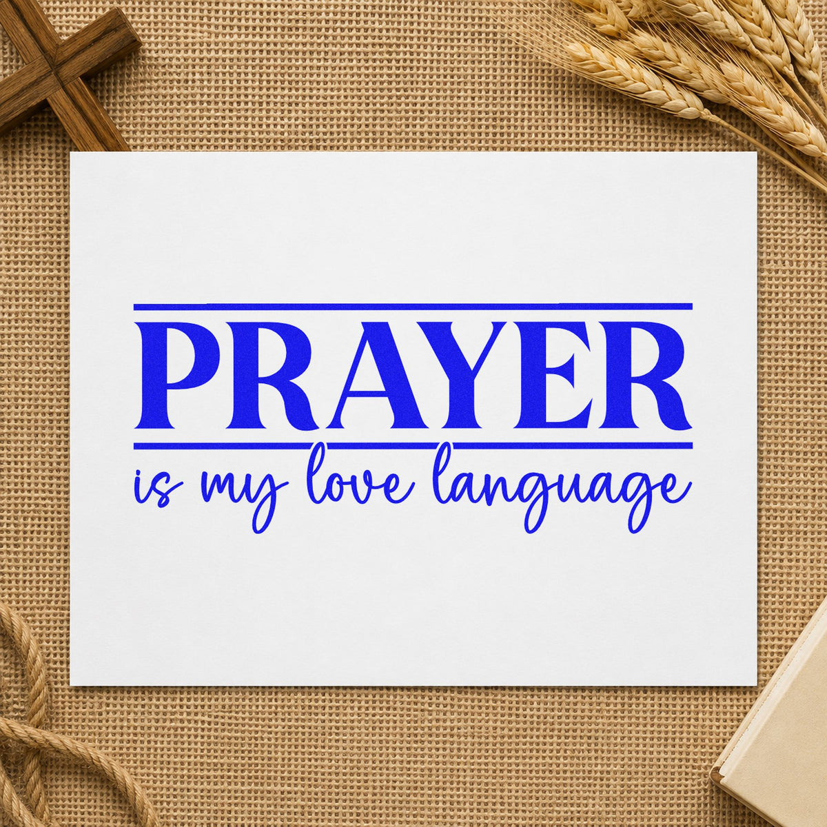 Prayer Is My Love Language craft stamp imprinted in blue ink on paper, a design suited to journal cover stamping.