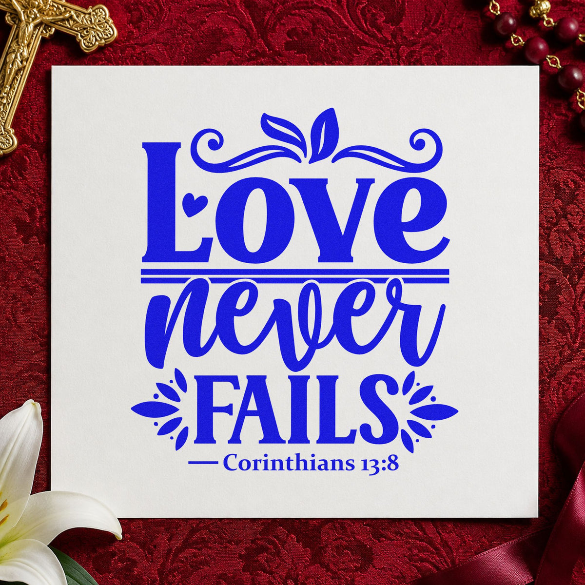 Love Never Fails craft stamp imprinted in blue ink on paper, a design suited to canvas pillow covers.