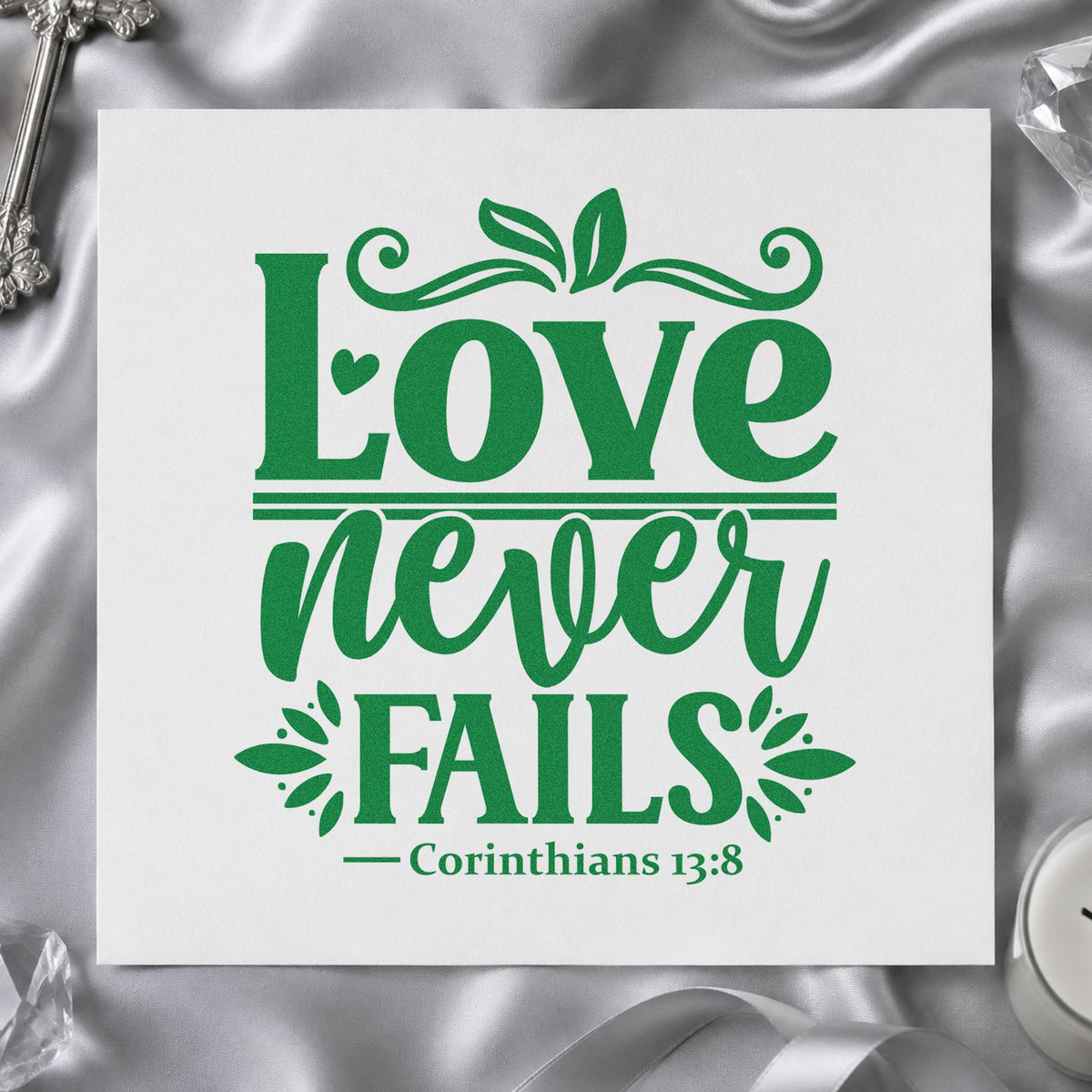 Love Never Fails craft stamp imprint in green ink on a handmade project, one idea being framed bedroom art.