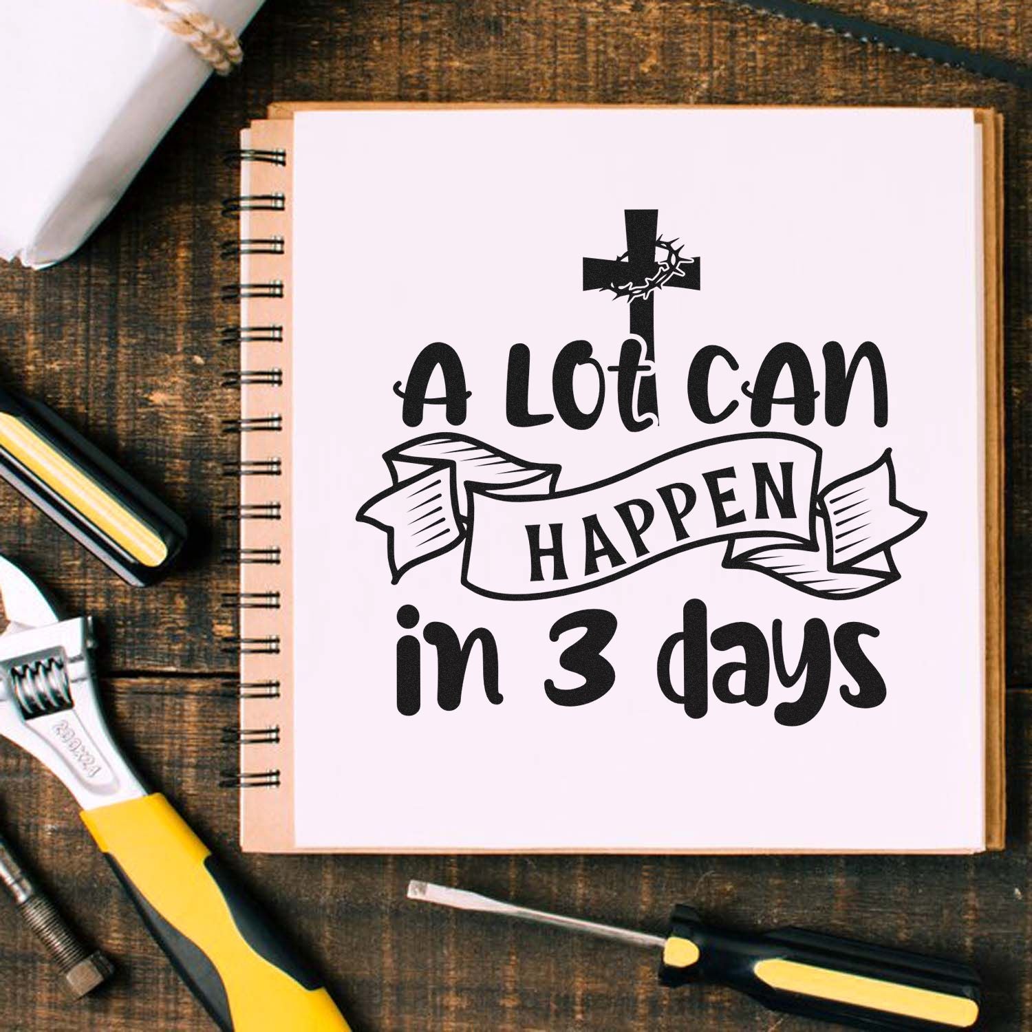 Christian Easter rubber stamp design featuring a cross and A lot can happen in 3 days quote on a notebook.