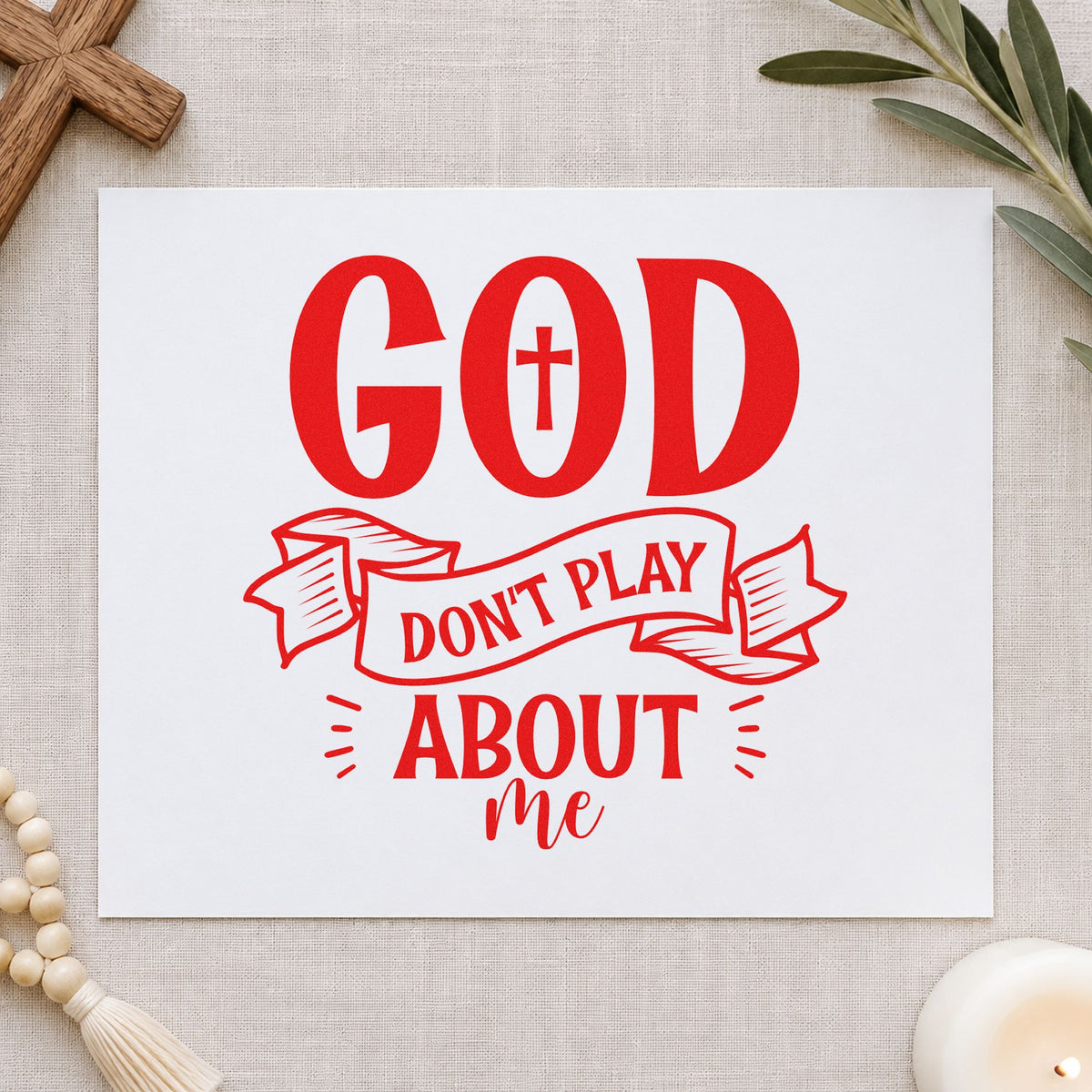 God Don't Play Ribbon rubber stamp shown in red ink, stamped for projects such as fridge magnets.