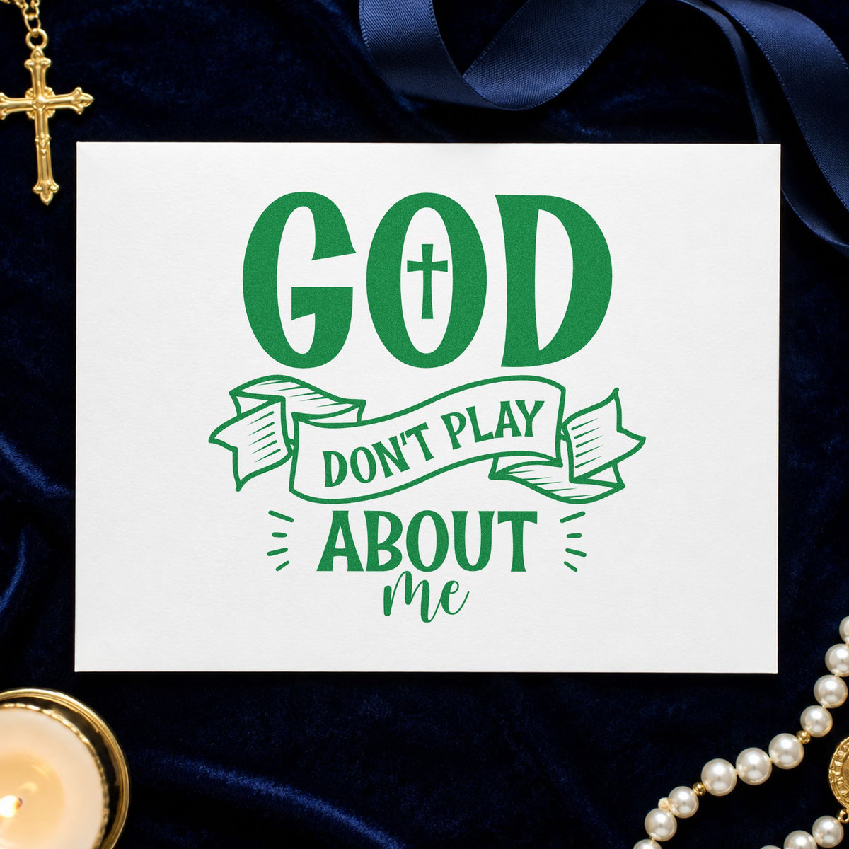 God Don't Play Ribbon craft stamp imprint in green ink on a handmade project, one idea being retreat name tags.