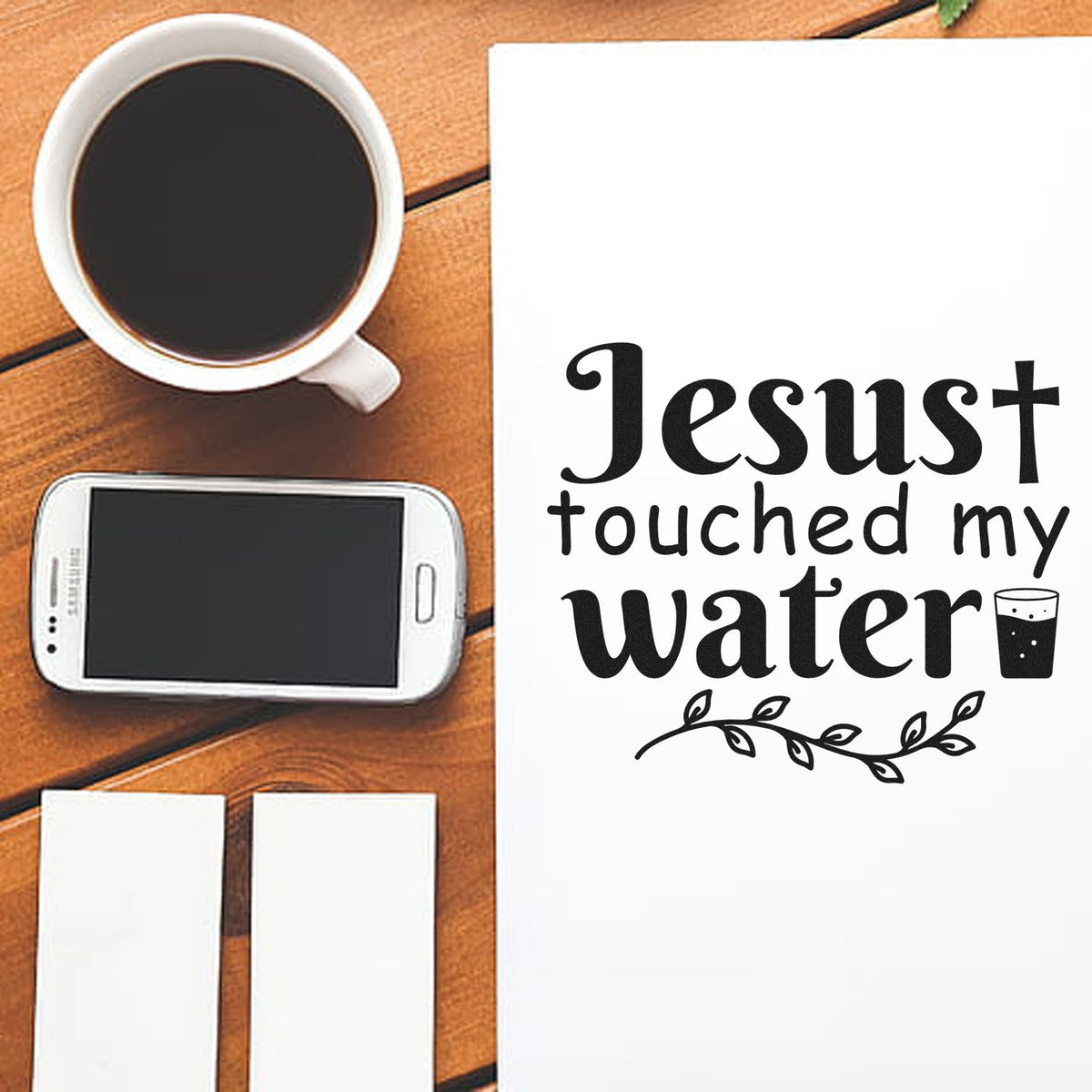 Premium Wooden Jesus Touched My Water With Cross Stamp - Vintage Pro imprint stamped in black ink. A cross, leafy sprig, and small drinking glass accompany "Jesus touched my water."
