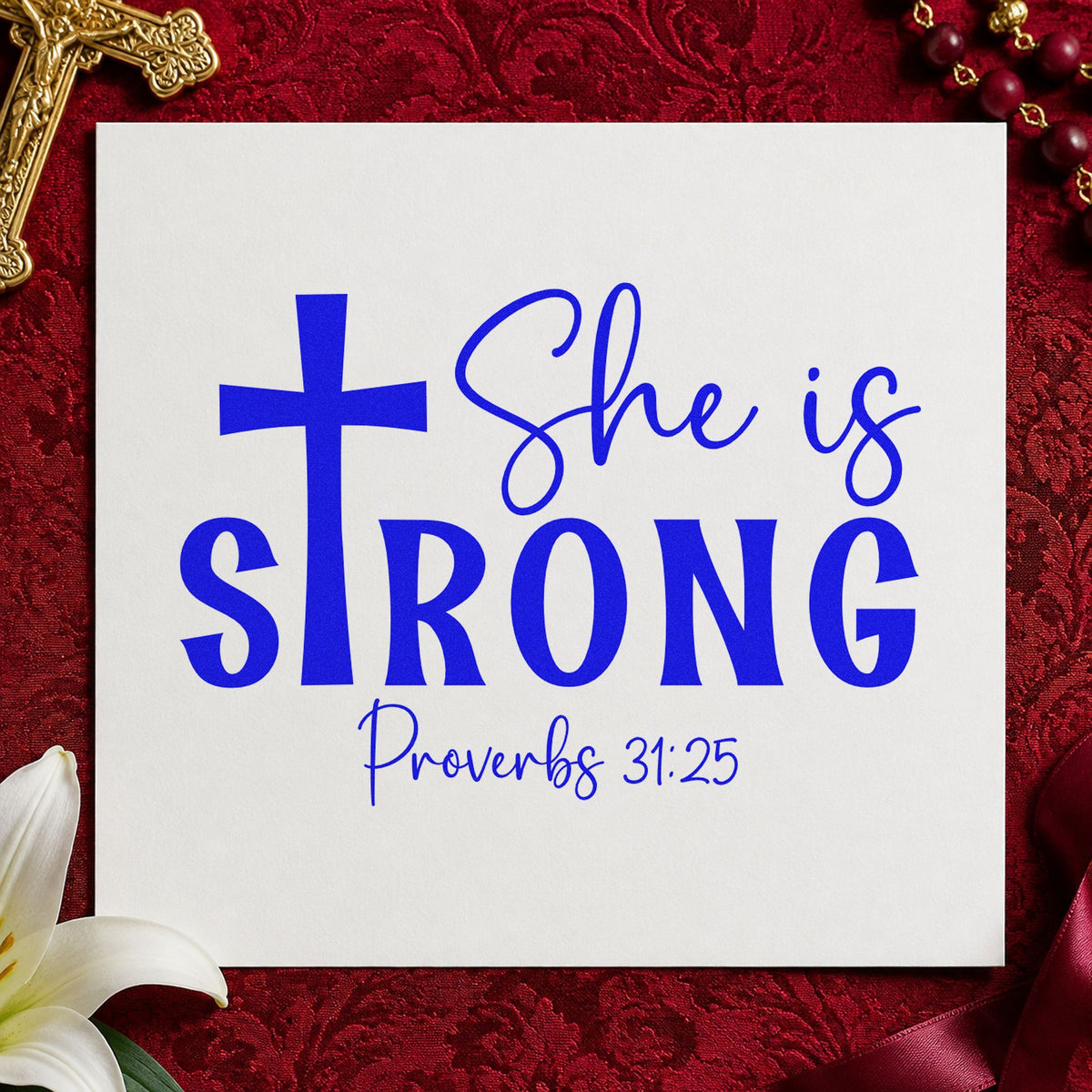 She Is Strong Cross craft stamp imprinted in blue ink on paper, a design suited to women's retreat tees.