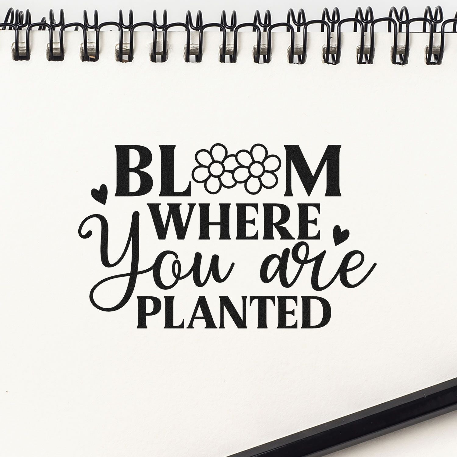 Bloom Where You Are Planted rubber stamp design with floral letters, hearts, and script typography for gardening crafts.