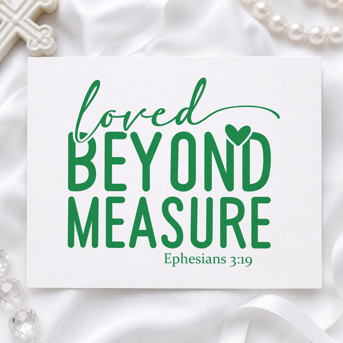 Loved Beyond Measure craft stamp imprint in green ink on a handmade project, one idea being baby shower favors.