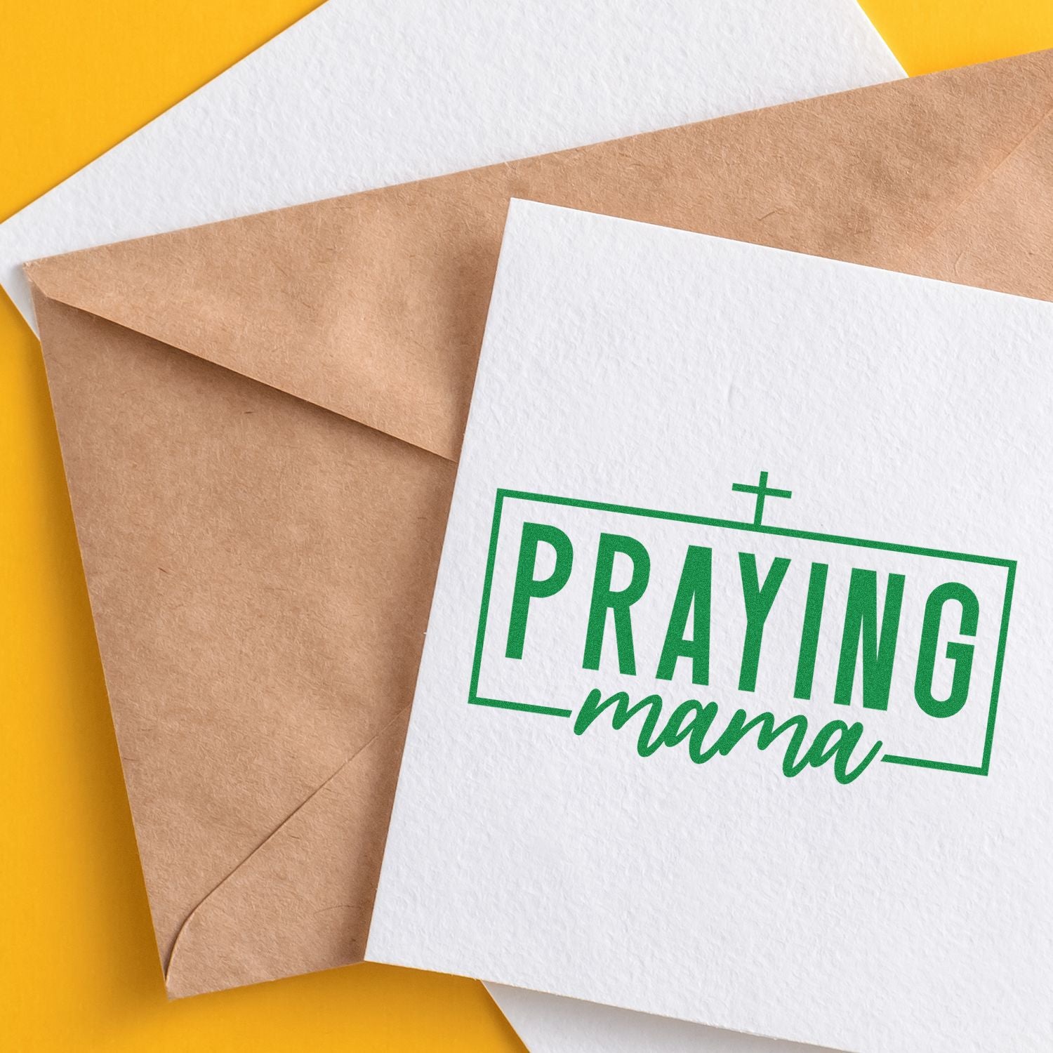 Praying Mama custom rubber stamp design on a greeting card with kraft envelope for faith-based stationery and gifts.