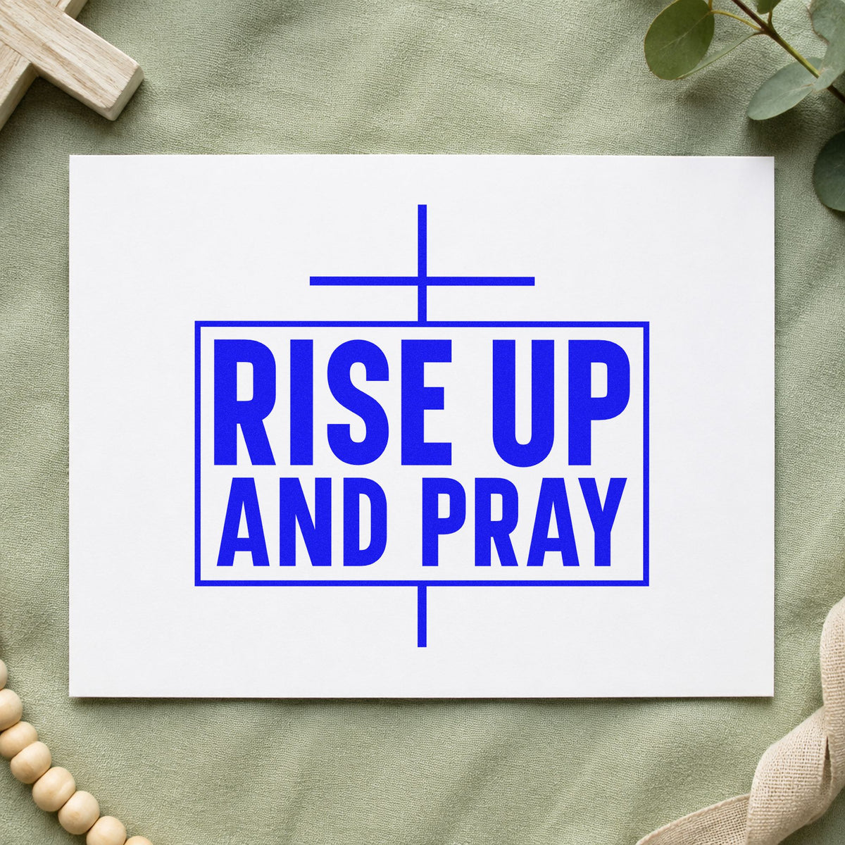 Rise Up and Pray craft stamp imprinted in blue ink on paper, a design suited to national prayer day signs.