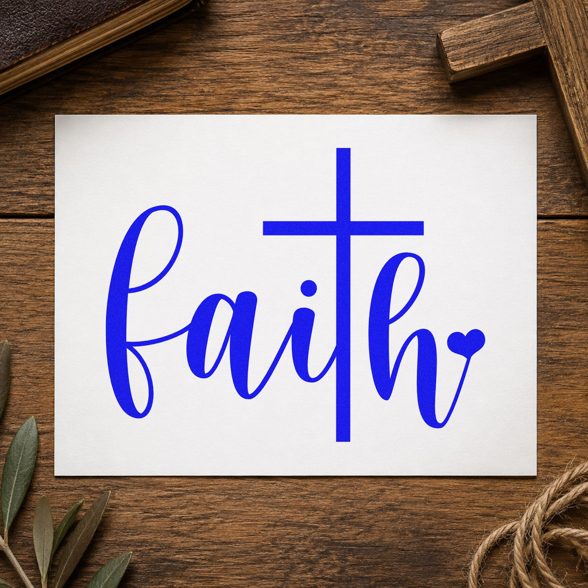 Faith Script Cross Heart craft stamp imprinted in blue ink on paper, a design suited to envelope seals.