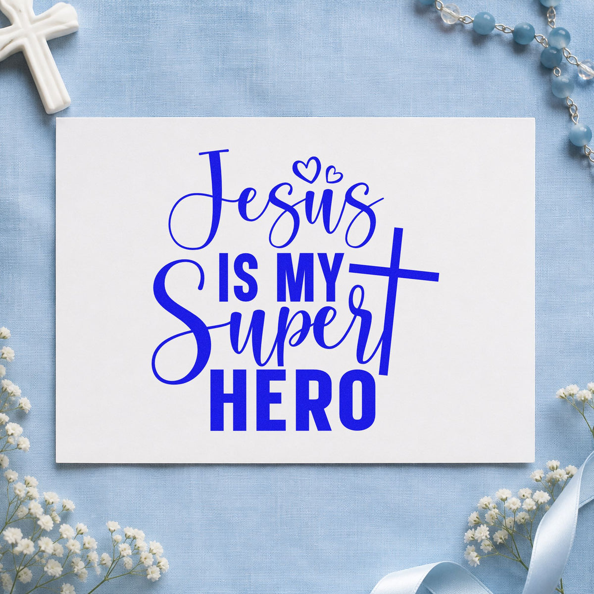 Jesus Is My Superhero craft stamp in blue ink on cardstock, an easy option for kids' tees.