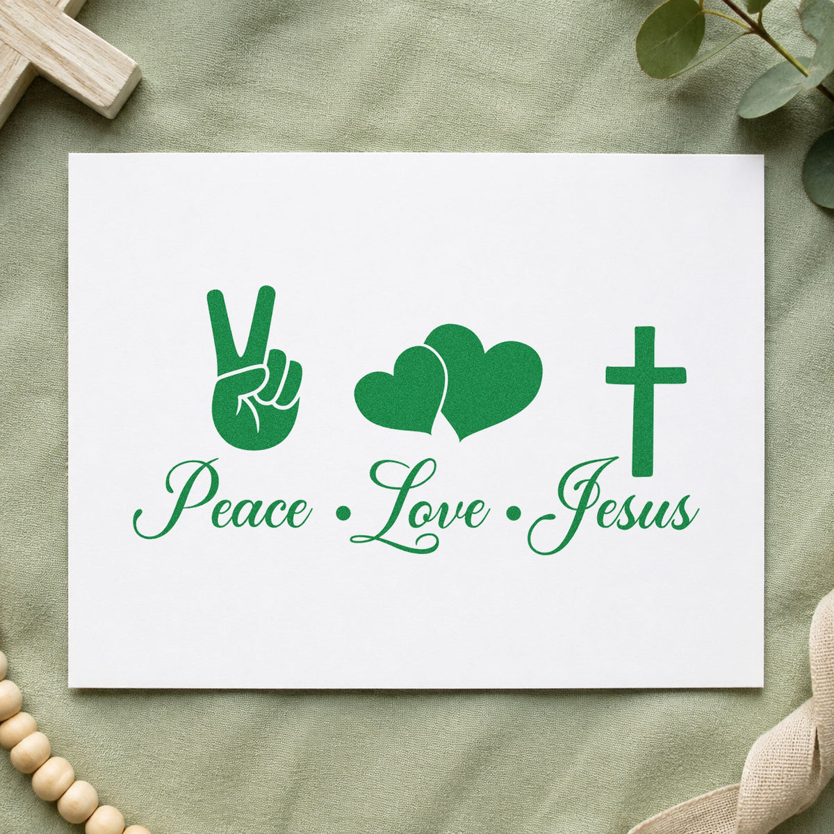 Peace Love Jesus craft stamp imprint in green ink on a handmade project, one idea being tie-dye tees.
