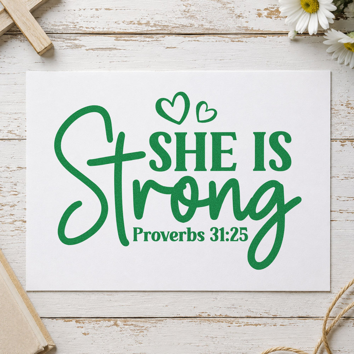 She Is Strong Hearts craft stamp imprint in green ink on a handmade project, one idea being female athlete gifts.