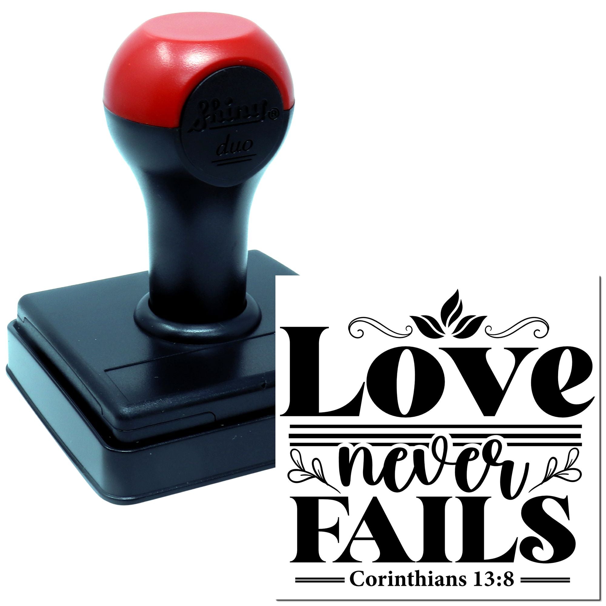 Custom self-inking rubber stamp with Love never fails and Corinthians 13:8 Bible verse design for faith-based crafting.